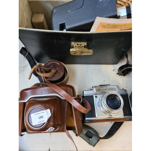 180 - Four items, an Agfa Ambi Silette film camera, Bell & Howell 8mm cine camera, pair of Carl Zeiss Deka... 