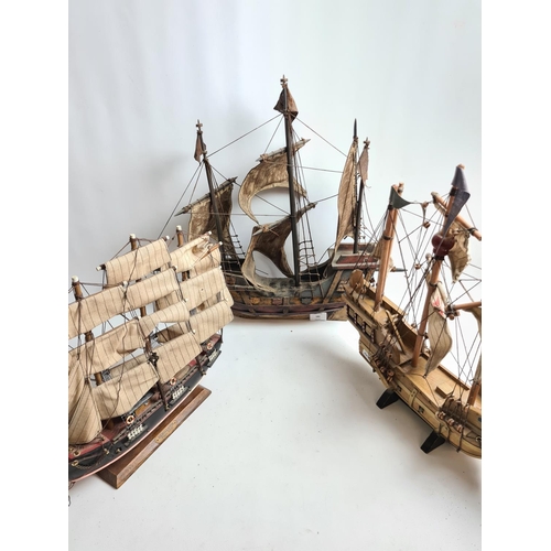 182 - Three wooden model ships