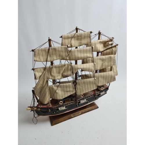 182 - Three wooden model ships