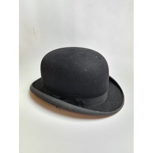 185 - Three vintage hats, a Dunn & Co. of London black bowler hat, Austin Reed Ltd. black bowler hat and a... 