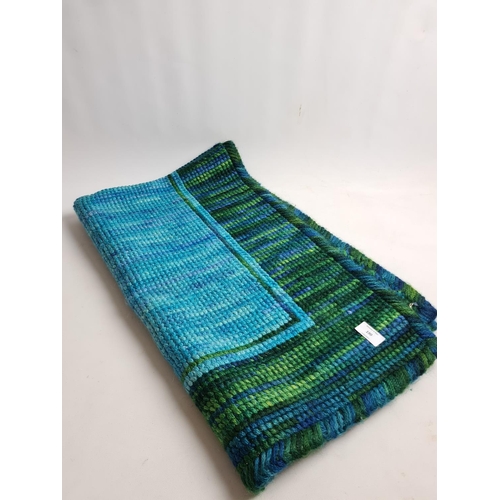 190 - A vintage style blue and green woollen rug