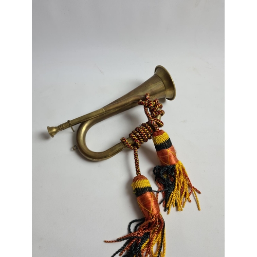 192 - Two items, a Turkish Dokuteks rug and a vintage brass bugle