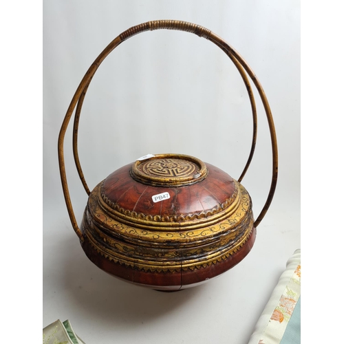 203 - Five Chinese collectable items to include a rice basket, wedding basket, two silk cushion covers and... 