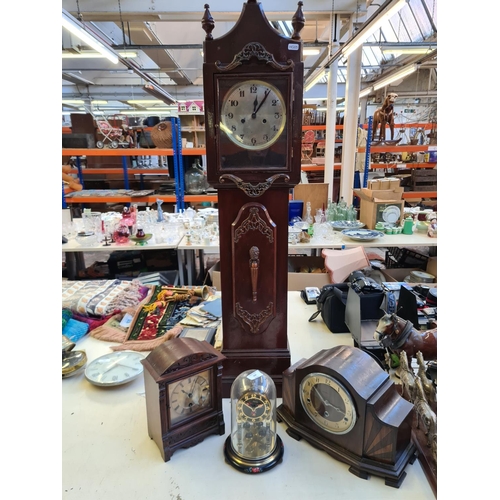 206 - Four various clocks to include a Hermle dome top anniversary clock, mahogany cased mantel clock, Art... 