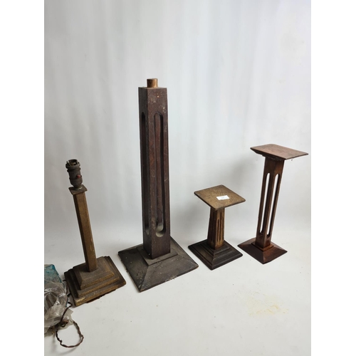 217 - Four items to include three vintage oak candle stands and one vintage table lamp base