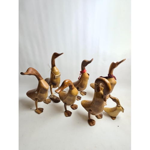 220 - Seven The Duck Company carved wooden duck figurines