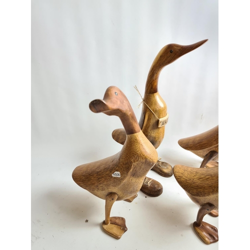 220 - Seven The Duck Company carved wooden duck figurines