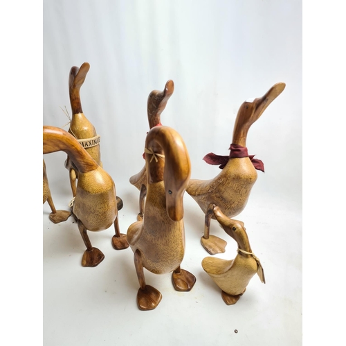 220 - Seven The Duck Company carved wooden duck figurines