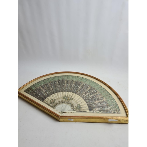 227 - A cased 19th century ivory fan with hand painted peacock design - approx. 62cm wide x 36cm high (inc... 