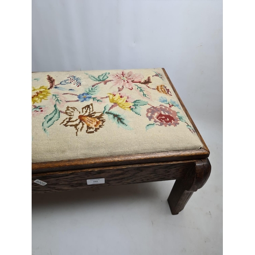 233 - An early 20th century oak and tapestry rectangular storage stool containing various sewing accessori... 