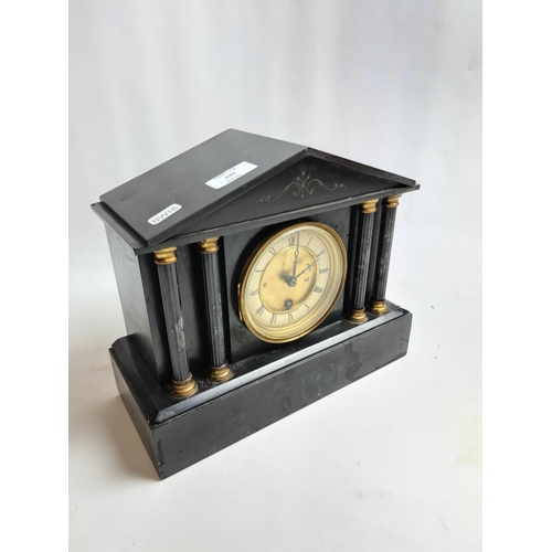 235 - A Victorian black slate mantel clock with pendulum and key - approx. 32cm wide x 26cm high 13cm deep