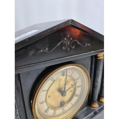 235 - A Victorian black slate mantel clock with pendulum and key - approx. 32cm wide x 26cm high 13cm deep