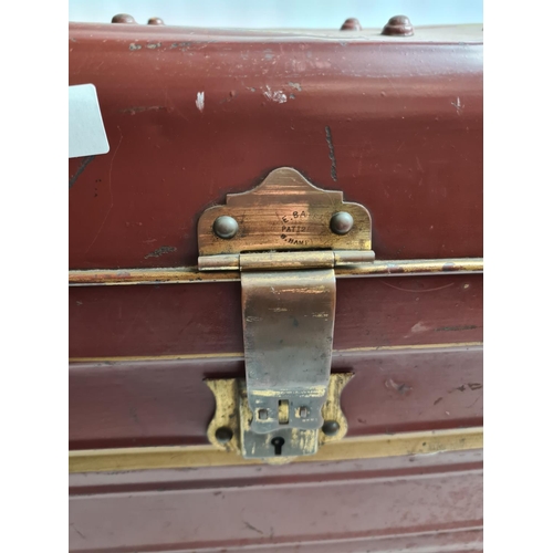 238 - A vintage brown metal travel trunk