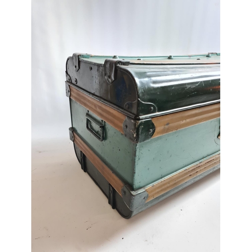 239 - A vintage green metal travel trunk