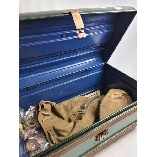 239 - A vintage green metal travel trunk