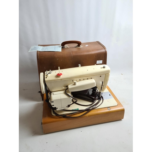 241 - A vintage cased Singer model 237 electric sewing machine