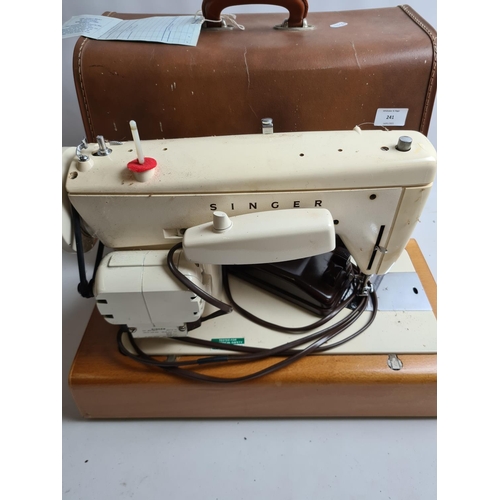 241 - A vintage cased Singer model 237 electric sewing machine