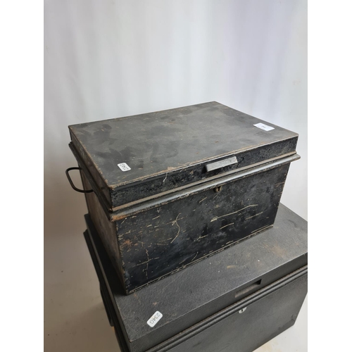 242 - Two vintage black metal deed boxes to include one Chubb & Sons Ltd. example