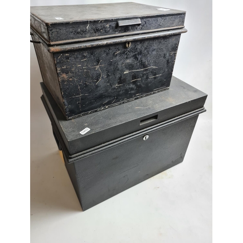 242 - Two vintage black metal deed boxes to include one Chubb & Sons Ltd. example