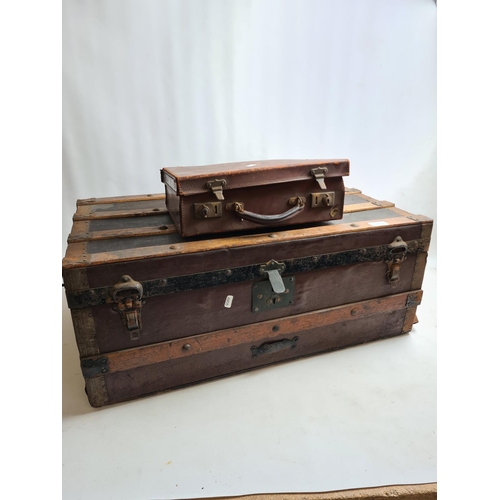 243 - Two items, a small vintage brown leather travel case and a large vintage oak banded travel trunk