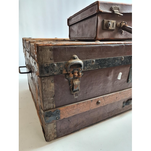 243 - Two items, a small vintage brown leather travel case and a large vintage oak banded travel trunk