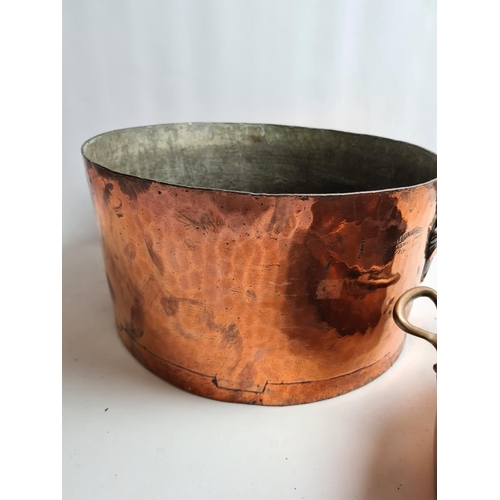 244 - Two items, a late 19th/early 20th century Leon Jaeggi copper saucepan - approx. 36cm in diameter and... 