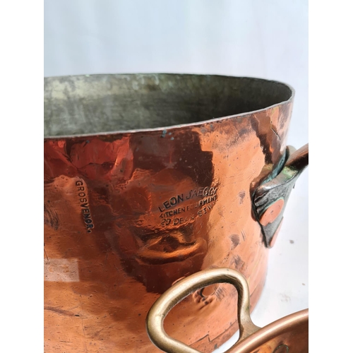 244 - Two items, a late 19th/early 20th century Leon Jaeggi copper saucepan - approx. 36cm in diameter and... 