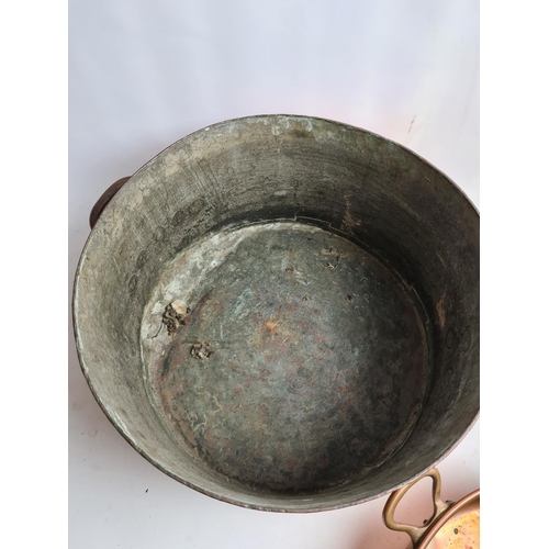 244 - Two items, a late 19th/early 20th century Leon Jaeggi copper saucepan - approx. 36cm in diameter and... 