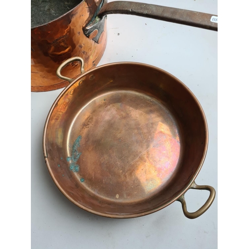 244 - Two items, a late 19th/early 20th century Leon Jaeggi copper saucepan - approx. 36cm in diameter and... 