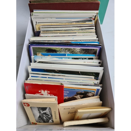 250 - A large collection of various postcards