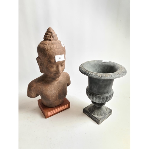 253 - Two items, a Victorian style cast iron urn and a Bayon style bust of Prajnaparamita/Great Mother - a... 