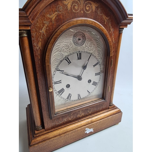 257 - An Edwardian inlaid mahogany cased bracket clock with later added Silent Chime face, labelled 