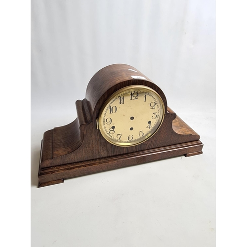 258 - A 1920s oak cased Napoleon hat Westminster chime mantel clock with Kienzle German movement