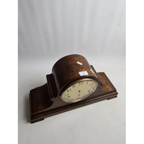 258 - A 1920s oak cased Napoleon hat Westminster chime mantel clock with Kienzle German movement