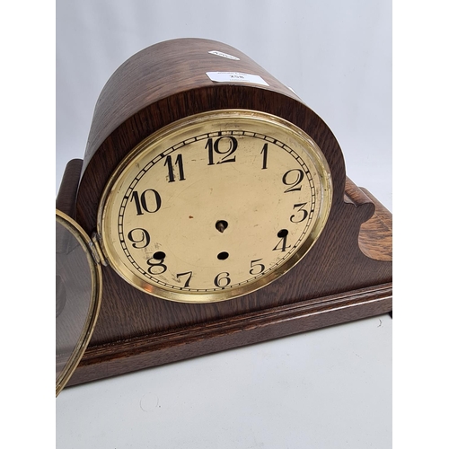 258 - A 1920s oak cased Napoleon hat Westminster chime mantel clock with Kienzle German movement