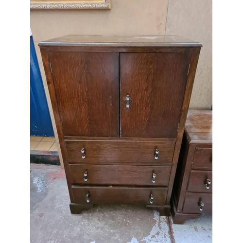 273 - An Art Deco oak two piece bedroom suite comprising dressing table and tall boy