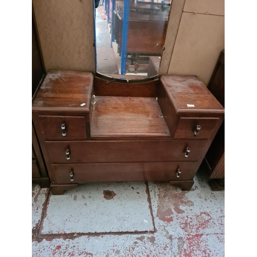 273 - An Art Deco oak two piece bedroom suite comprising dressing table and tall boy