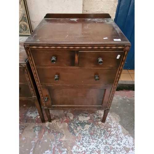 277 - A vintage mahogany two piece bedroom suite comprising cabinet and dressing table