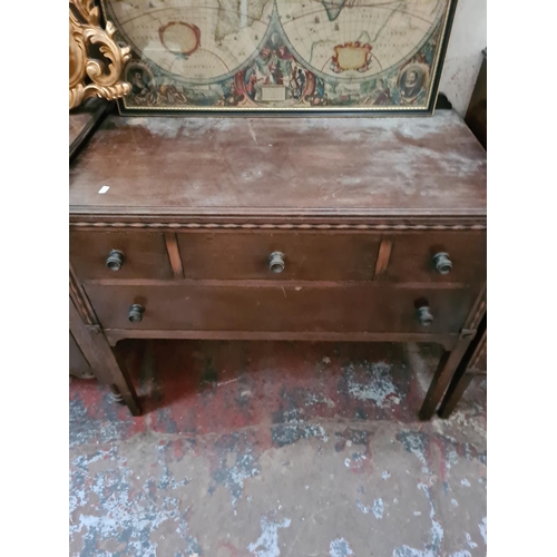 277 - A vintage mahogany two piece bedroom suite comprising cabinet and dressing table