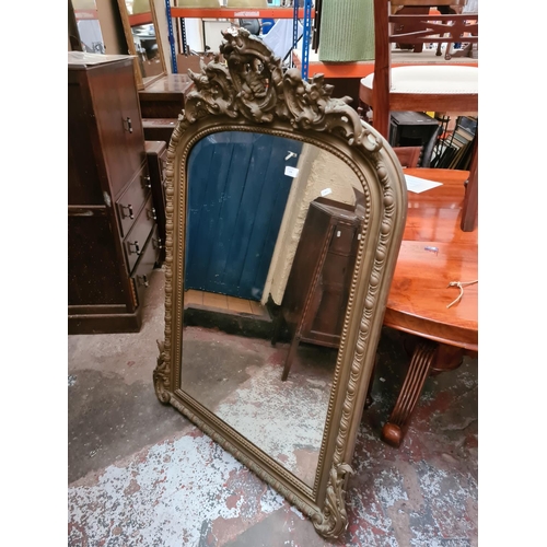 278 - A Victorian gilt framed bevelled edge over mantel mirror - approx 136cm high x 86cm wide