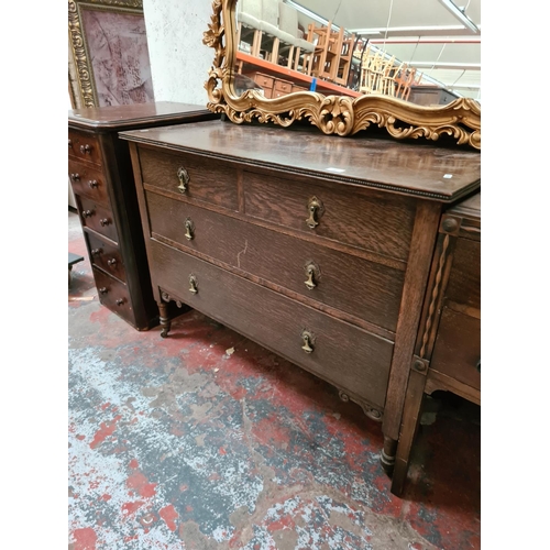 282 - An oak chest of two short over two long drawers on casters - approx. 107cm wide x 80cm high x 50cm d... 