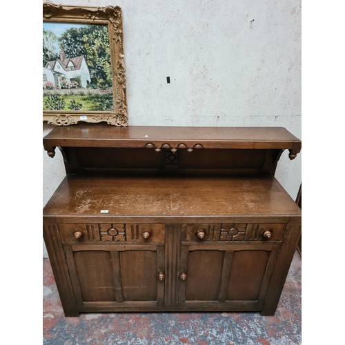 285 - An oak sideboard - approx. 137cm wide x 113 high x 46cm deep