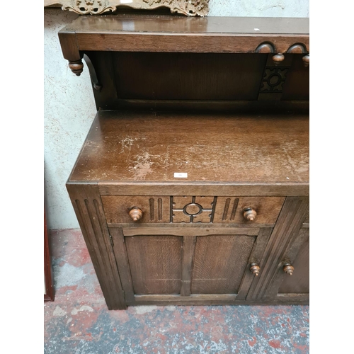 285 - An oak sideboard - approx. 137cm wide x 113 high x 46cm deep