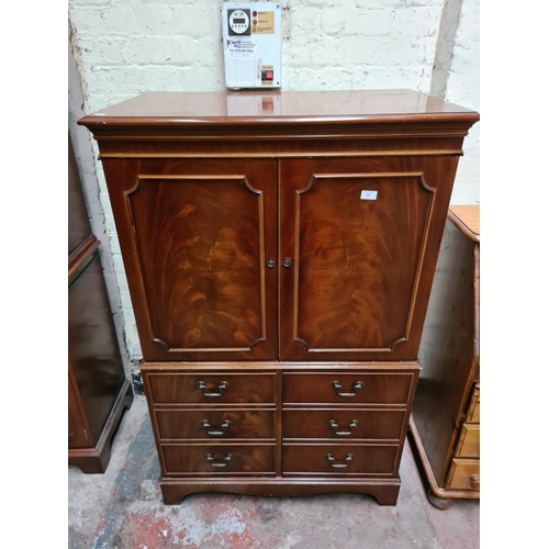 295 - A mahogany drinks cabinet - approx. 143cm high x 91cm wide x 55cm deep