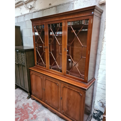 296 - A large mahogany display cabinet - approx. 140cm wide x 42cm deep x 197cm high