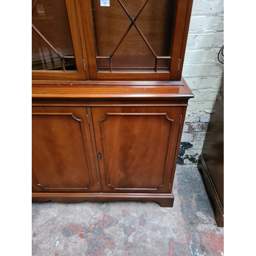 296 - A large mahogany display cabinet - approx. 140cm wide x 42cm deep x 197cm high