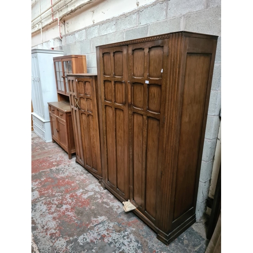 299 - Two matching oak double wardrobes