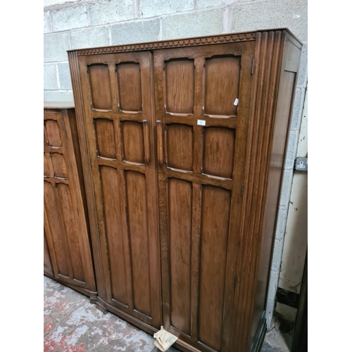 299 - Two matching oak double wardrobes