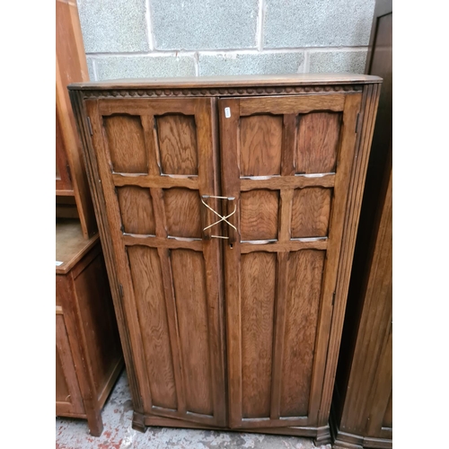 299 - Two matching oak double wardrobes