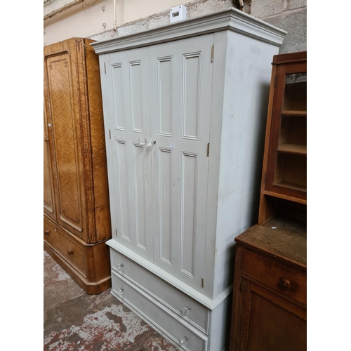 301 - A grey painted pine double wardrobe - approx. 196cm high x 110cm wide x 55cm deep